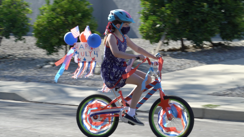 A Young 4th of July Celebrator Wears a Mask