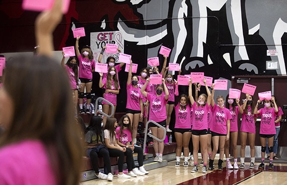 The Claremont High School Volleyball Team Participates in a Pink Out Game